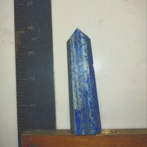 Lapis lazuli obelisk with gold flashes.